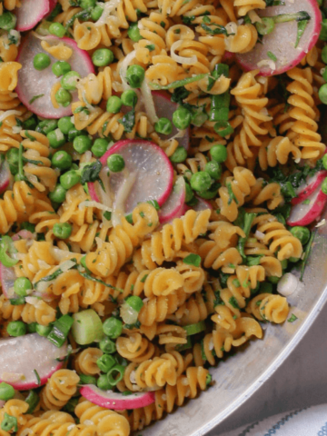 sautéed radish and green pea pasta in skillet